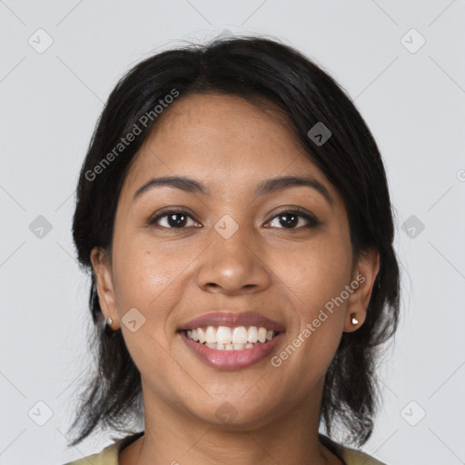 Joyful latino young-adult female with medium  brown hair and brown eyes