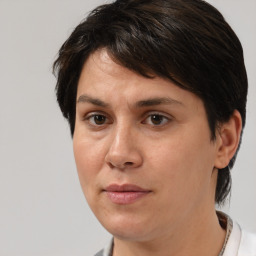 Joyful white adult female with medium  brown hair and brown eyes