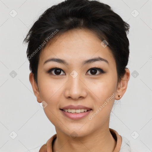 Joyful asian young-adult female with short  black hair and brown eyes