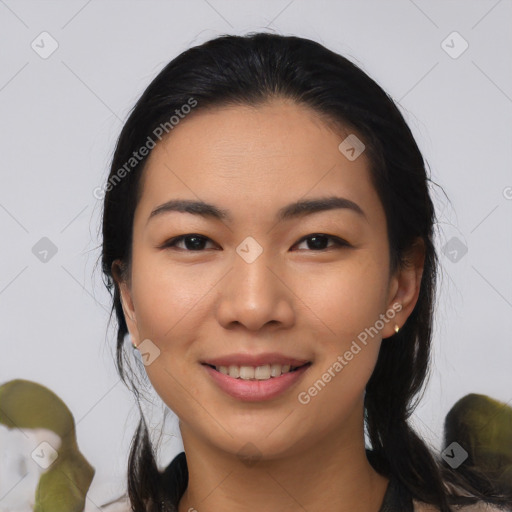 Joyful asian young-adult female with medium  black hair and brown eyes