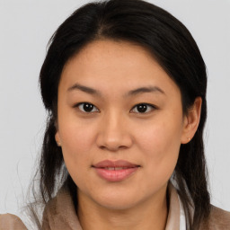 Joyful asian young-adult female with medium  brown hair and brown eyes