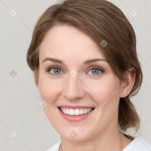 Joyful white young-adult female with medium  brown hair and green eyes