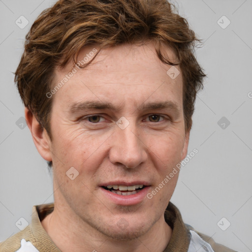 Joyful white adult male with short  brown hair and grey eyes