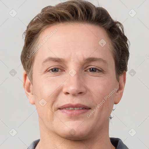 Joyful white adult female with short  brown hair and grey eyes