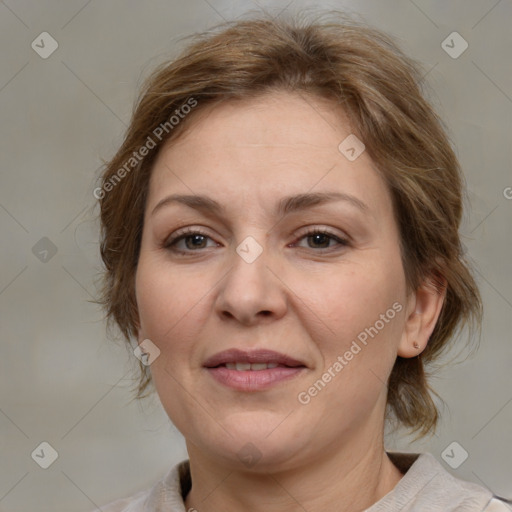 Joyful white adult female with medium  brown hair and grey eyes