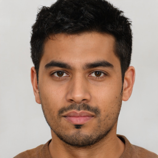 Neutral latino young-adult male with short  brown hair and brown eyes