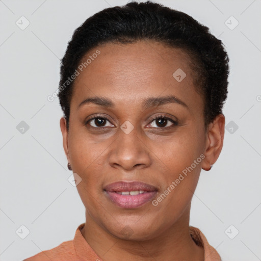 Joyful black adult female with short  brown hair and brown eyes