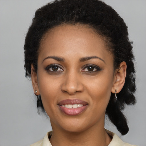 Joyful latino young-adult female with medium  black hair and brown eyes