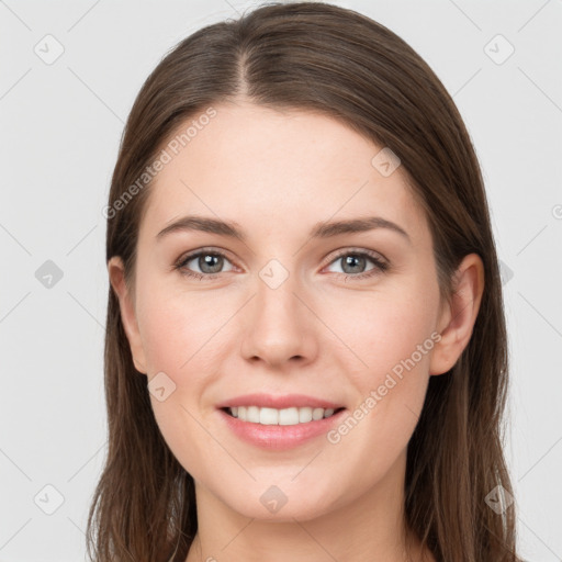 Joyful white young-adult female with long  brown hair and grey eyes