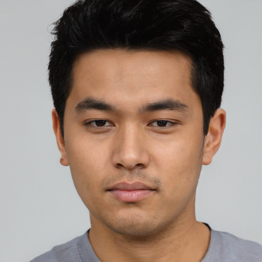 Neutral asian young-adult male with short  black hair and brown eyes