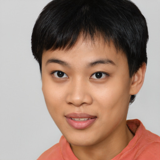 Joyful asian young-adult female with short  brown hair and brown eyes