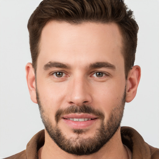 Joyful white young-adult male with short  brown hair and brown eyes