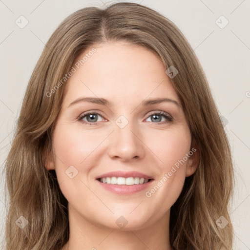 Joyful white young-adult female with long  brown hair and green eyes