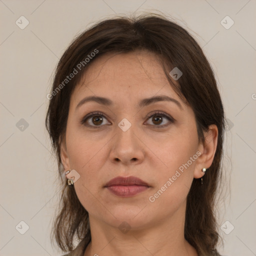 Joyful white adult female with medium  brown hair and grey eyes