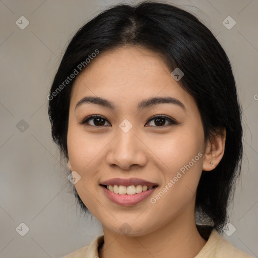 Joyful latino young-adult female with medium  brown hair and brown eyes