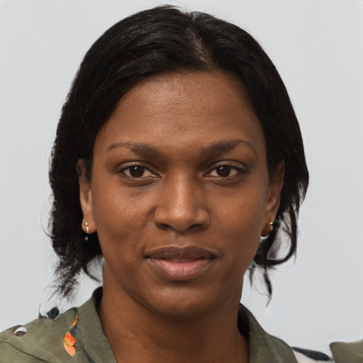 Joyful black young-adult female with medium  brown hair and brown eyes