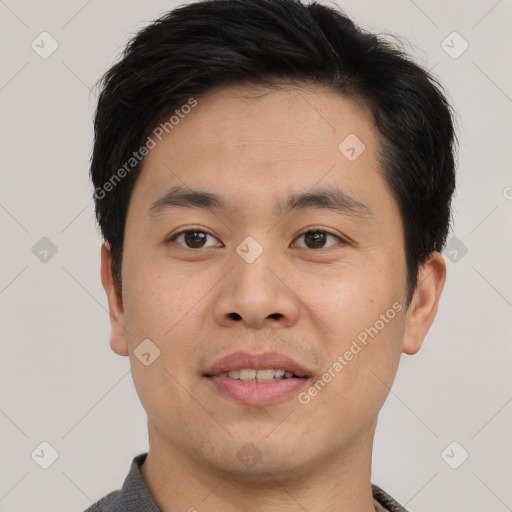 Joyful asian young-adult male with short  brown hair and brown eyes