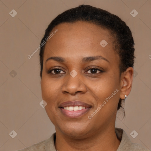 Joyful black young-adult female with short  brown hair and brown eyes