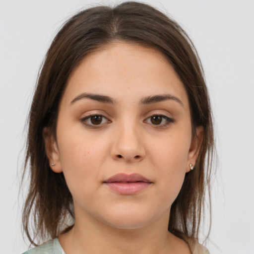 Neutral white young-adult female with medium  brown hair and brown eyes