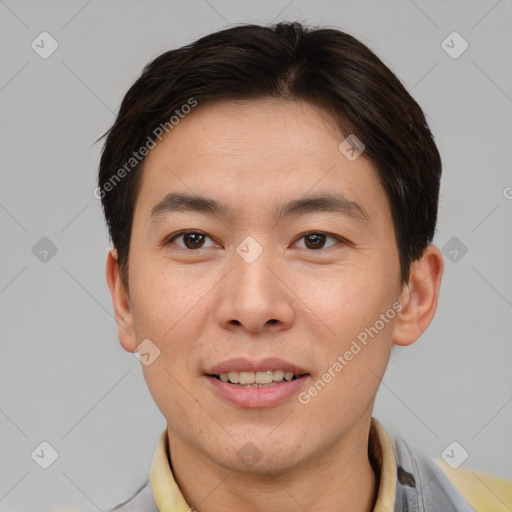 Joyful asian young-adult male with short  brown hair and brown eyes