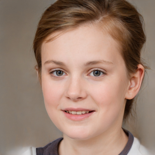 Joyful white child female with medium  brown hair and brown eyes