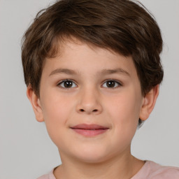 Joyful white child male with short  brown hair and brown eyes