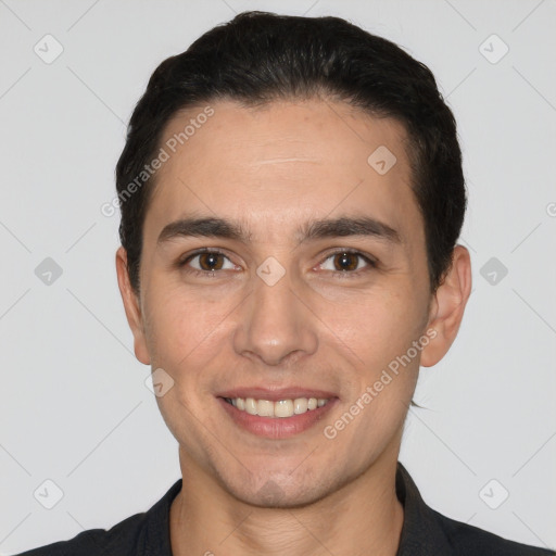 Joyful white young-adult male with short  black hair and brown eyes