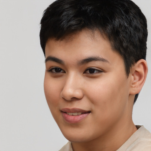 Joyful asian young-adult male with short  brown hair and brown eyes