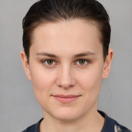 Joyful white young-adult female with short  brown hair and grey eyes