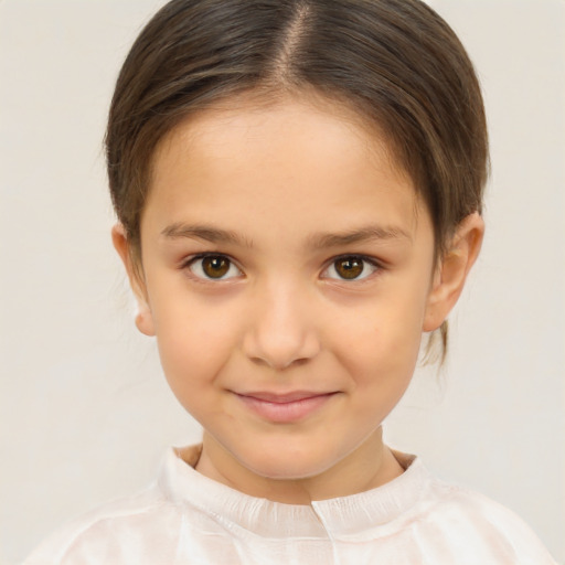 Joyful white child female with short  brown hair and brown eyes