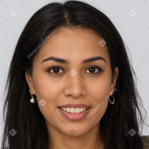 Joyful latino young-adult female with long  brown hair and brown eyes