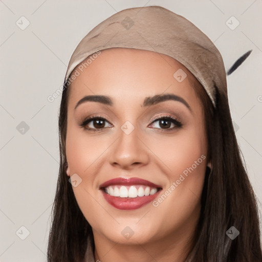 Joyful white young-adult female with long  black hair and brown eyes