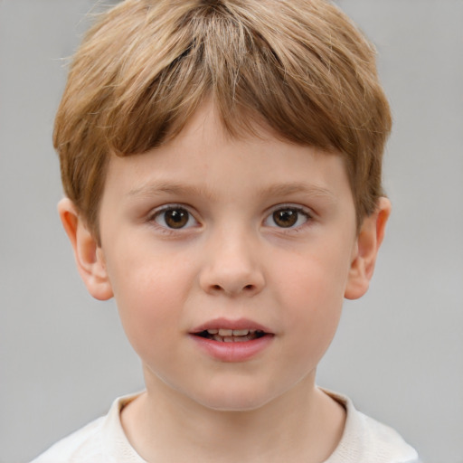 Joyful white child male with short  brown hair and brown eyes