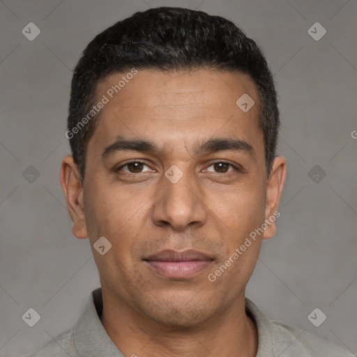 Joyful white young-adult male with short  black hair and brown eyes