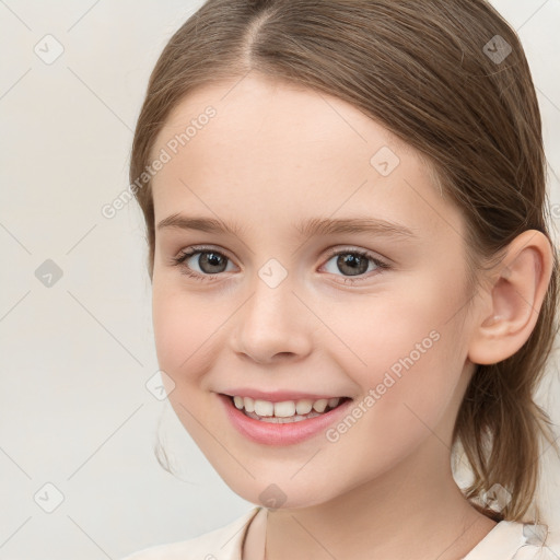 Joyful white child female with medium  brown hair and brown eyes