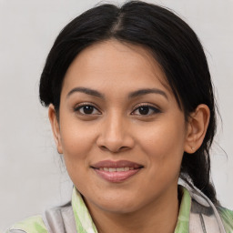 Joyful asian young-adult female with medium  brown hair and brown eyes