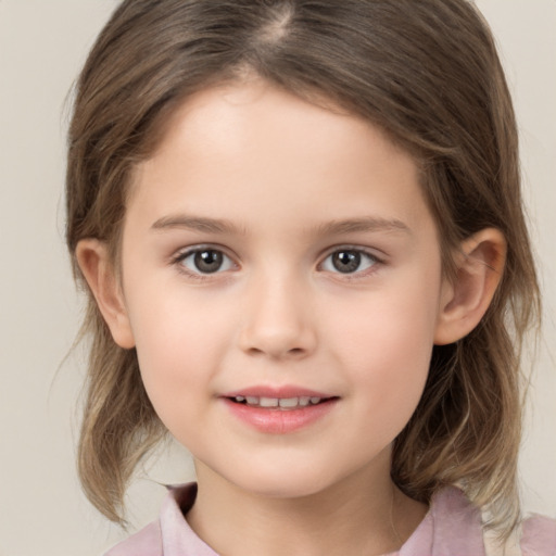 Joyful white child female with medium  brown hair and brown eyes