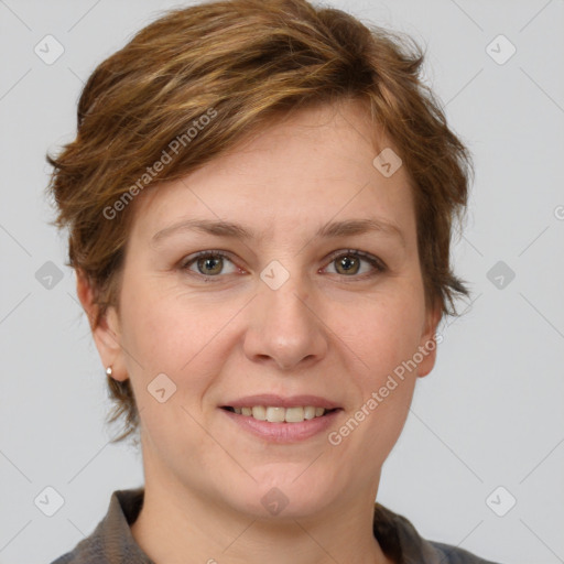 Joyful white adult female with short  brown hair and grey eyes