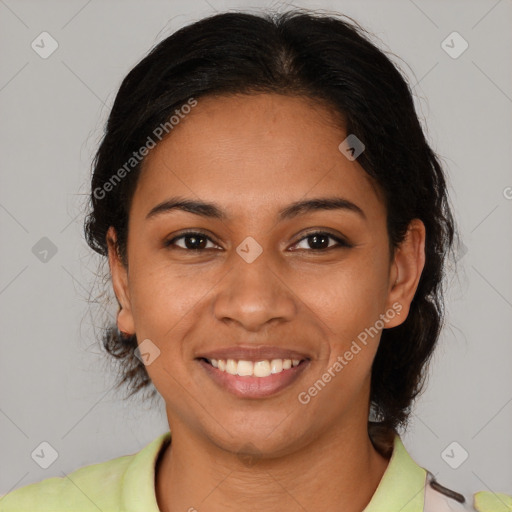 Joyful latino young-adult female with medium  brown hair and brown eyes