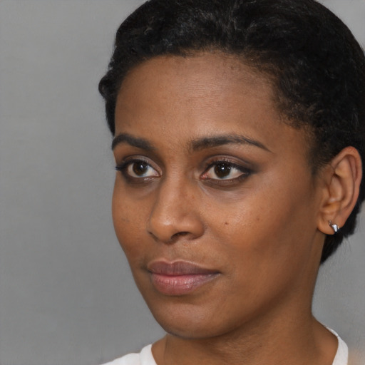 Neutral black young-adult female with short  brown hair and brown eyes