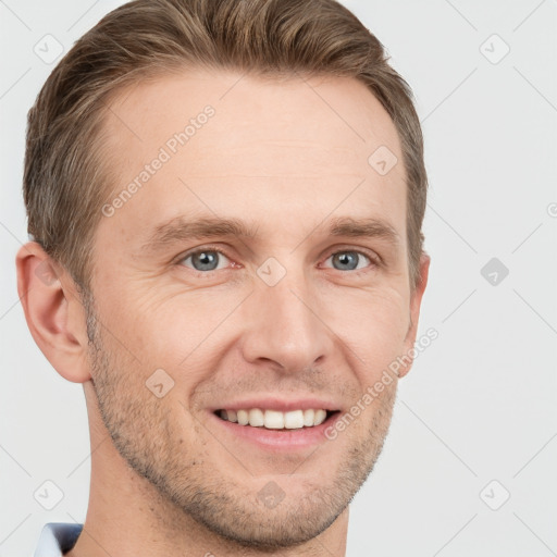 Joyful white adult male with short  brown hair and grey eyes