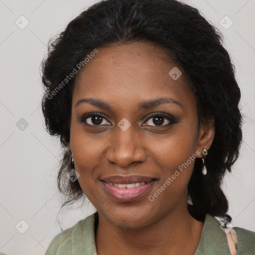 Joyful black young-adult female with long  brown hair and brown eyes