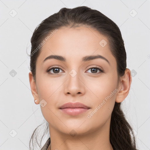 Neutral white young-adult female with long  brown hair and brown eyes