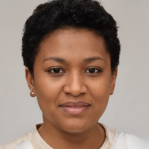 Joyful black young-adult female with short  brown hair and brown eyes