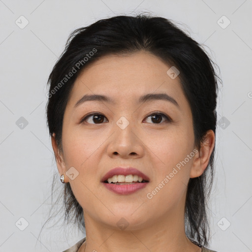 Joyful asian young-adult female with medium  black hair and brown eyes