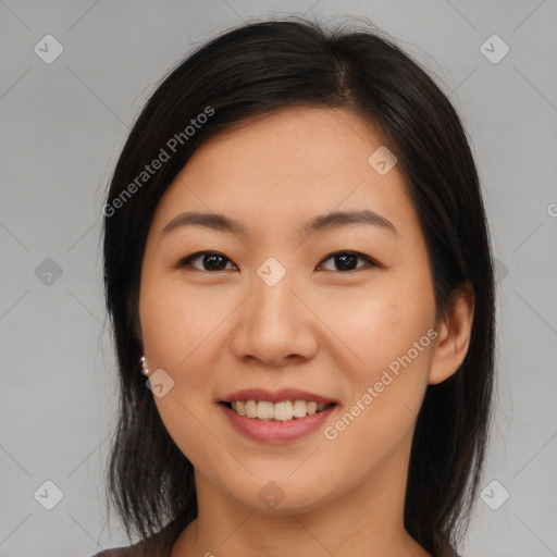 Joyful asian young-adult female with medium  brown hair and brown eyes