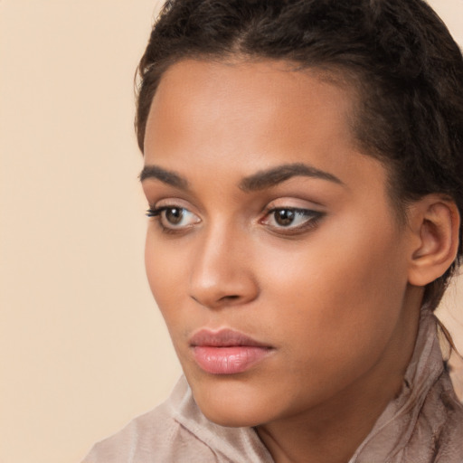 Neutral latino young-adult female with long  brown hair and brown eyes