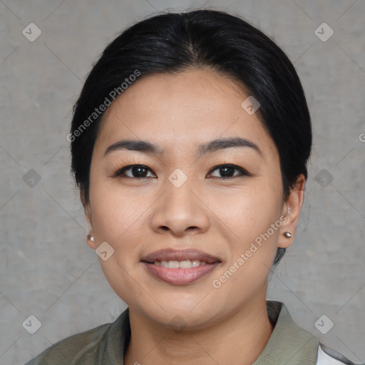 Joyful asian young-adult female with medium  black hair and brown eyes