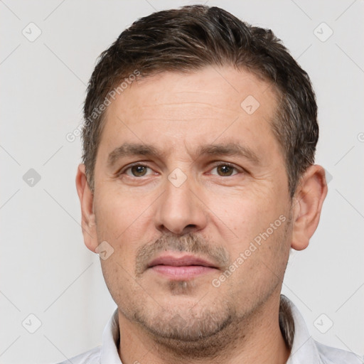 Neutral white adult male with short  brown hair and brown eyes