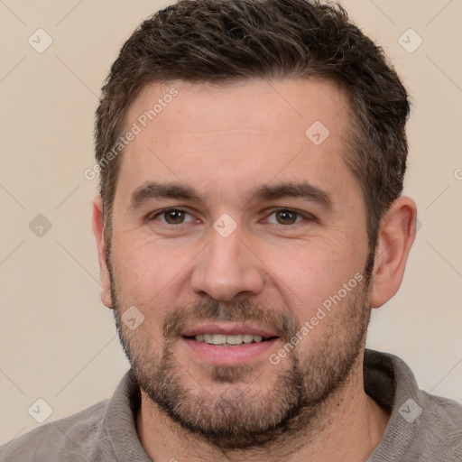 Joyful white young-adult male with short  brown hair and brown eyes